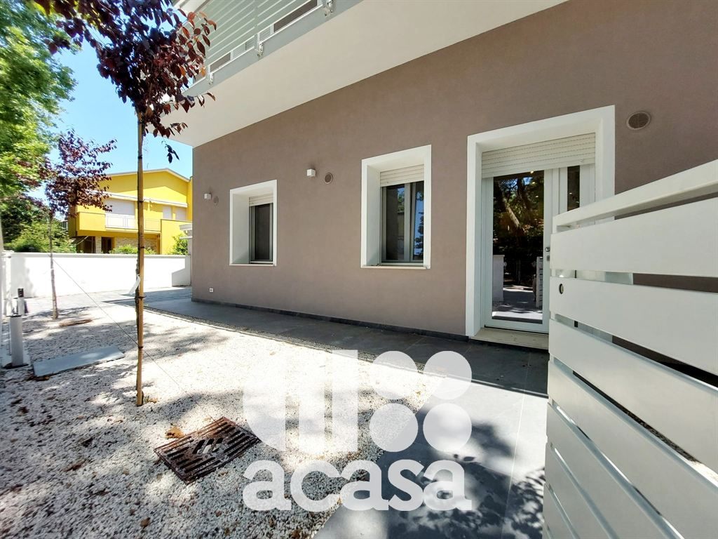 APPARTAMENTO NUOVO CON GIARDINO E GARAGE